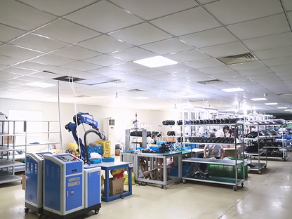 Bright automotive lighting assembly workshop with machinery